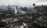 Resturi din avionul MH17 prăbușit în Ucraina