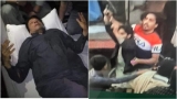 Imran Khan, întins pe targă, și presupusul atacator