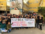 Susținătorii unui anarhist italian au incendiat mașini și au amenințat oficiali în semn de protest față de condițiile din închisoare ale acestuia