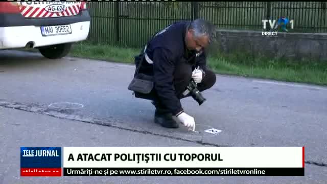 Polițist atacat cu toporul
